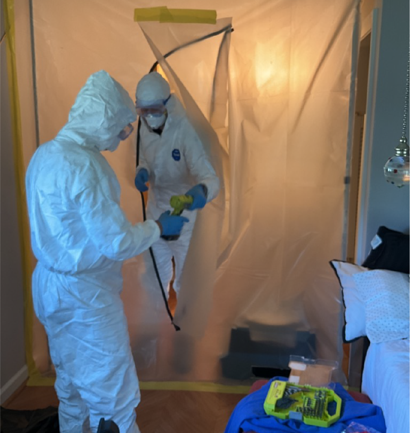 Mold Specialists Leaving Containment Area After Cleaning and Remediation in Port St. Lucie, FL